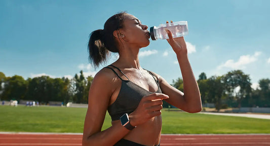 runner drinking and staying hydrated